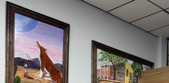 Framed paintings on the wall at Allied Express, LaPlace, LA